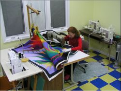 Caryl quilting on Legacy machine